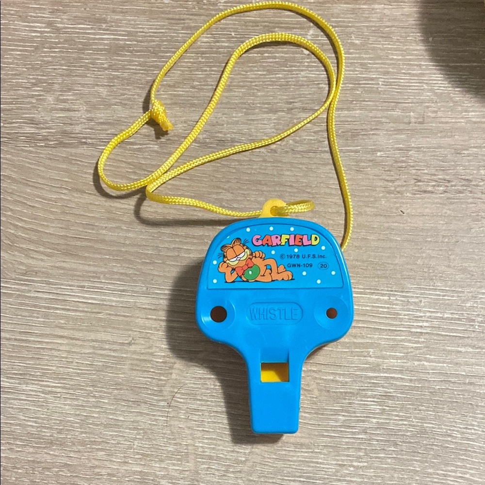 Vintage 1978 Garfield Blue and Yellow Plastic Whistle